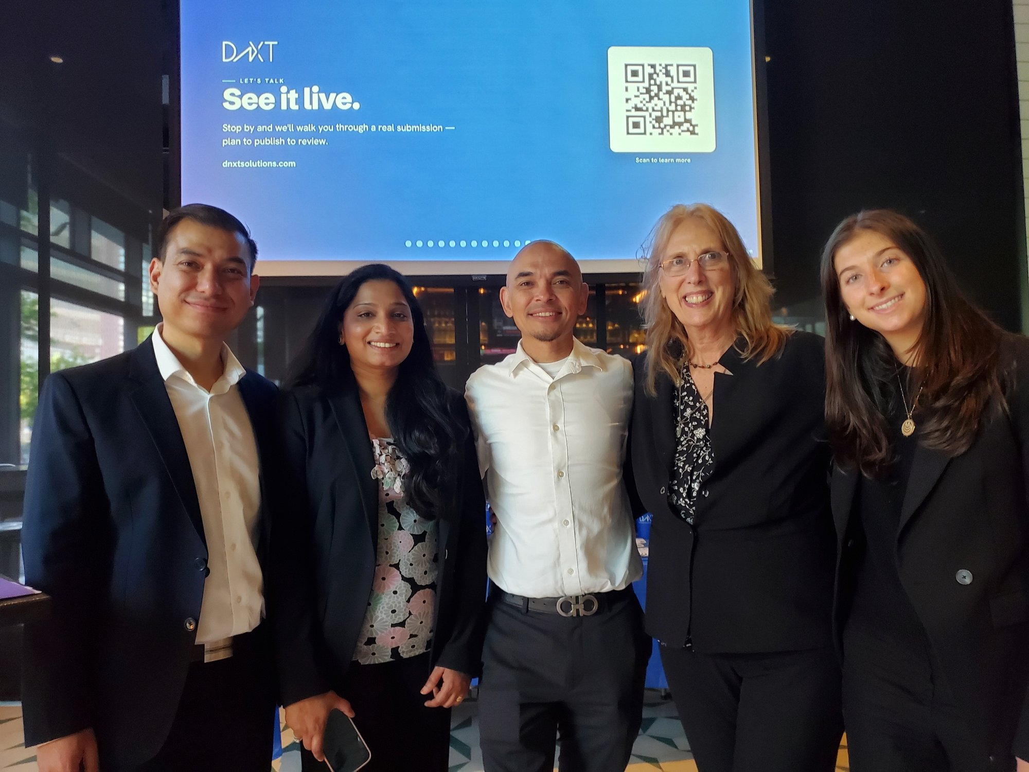 Members of the DnXT team at a DnXT event